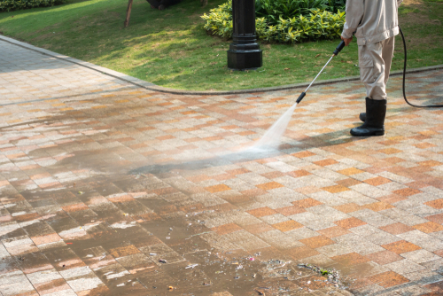 our team pressure washing a drive way