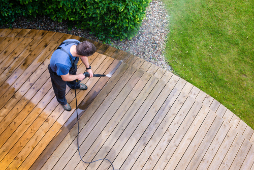 pressure washing a backward deck at a residential home