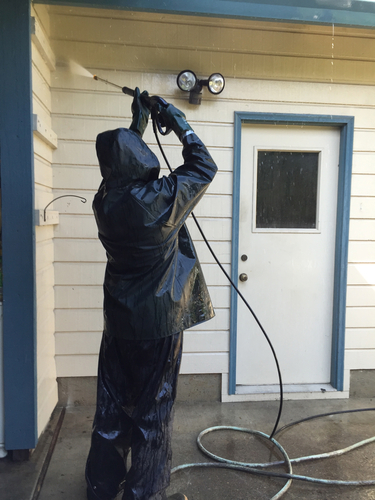 pressure washing the exterior of a home